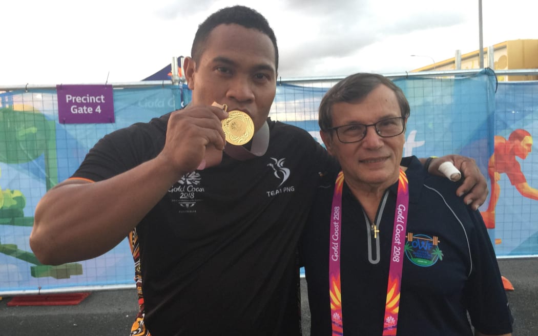 Steven Kari and coach Paul Coffa after his win at the Gold Coast Commonwealth Games.