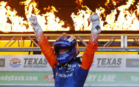 FORT WORTH, TEXAS - JUNE 06: Scott Dixon, driver of the #9 PNC Bank Chip Ganassi Racing Honda, celebrates in Victory Lane after winning the NTT IndyCar Series - Genesys 300 at Texas Motor Speedway on June 06, 2020 in Fort Worth, Texas.   Tom Pennington/Getty Images/AFP