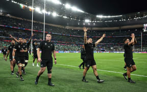 New Zealand's players celebrate after winning their quarter-final Rugby World Cup 2023 match between Ireland and New Zealand