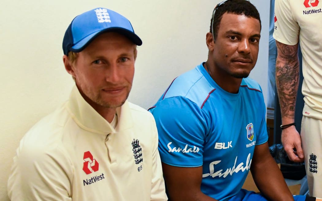 Joe Root of England in the dressing room with Shannon Gabriel of West Indies at the end of day 4 of the 3rd and final Test between West Indies and England.