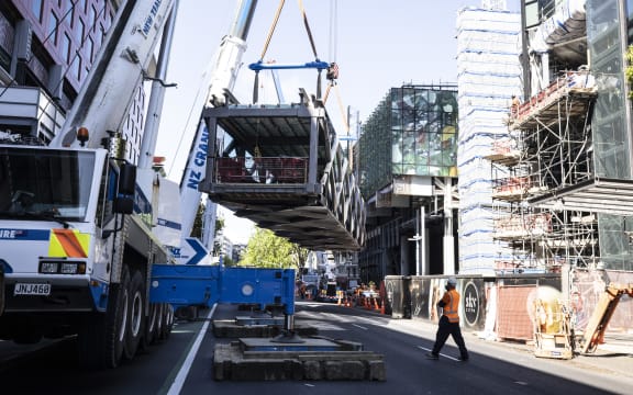 Bridge being craned into position between NZICC Horizon Hotel and SkyCity on 24 October, 2020.