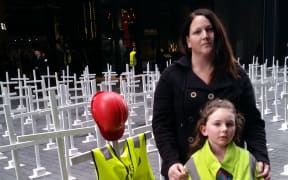 Deborah McMillan and her daughter Skylar, 8. Her husband Shane McMillan was killed in a forestry accident in 2009