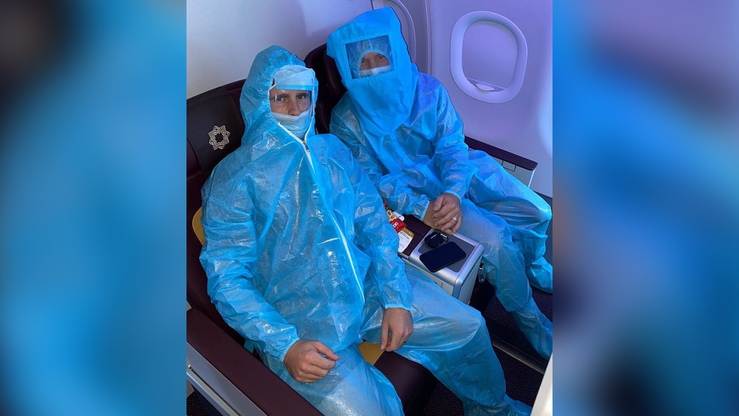 Kane Williamson and David Warner in full PPE on a flight to Delhi for India Premier League.