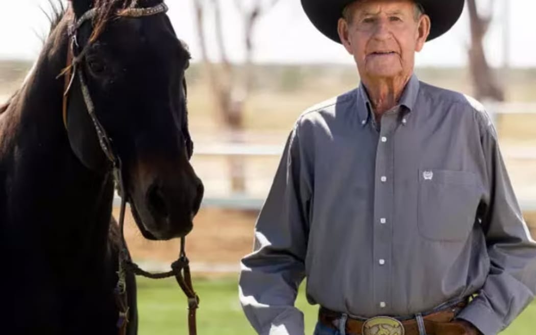 Aussie cowboy Bob Holder wearing his prized belt buckle.