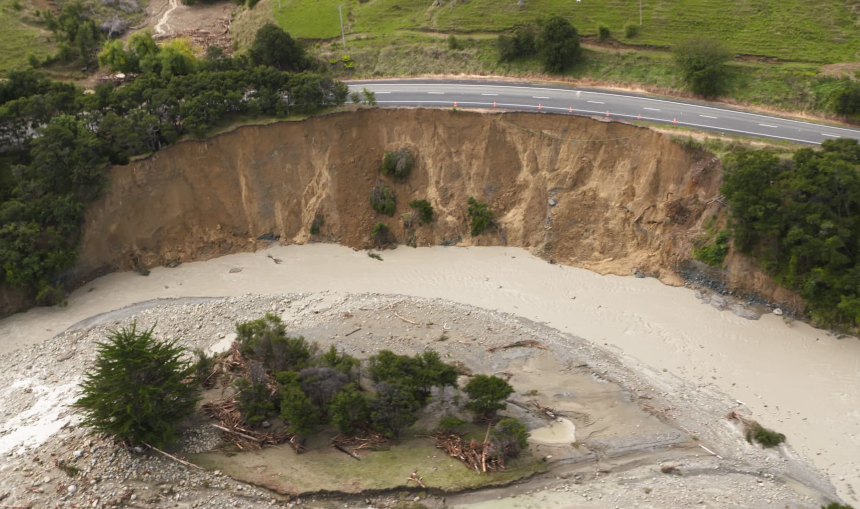 Mangahauini River eats away at State Highway 35 near Tokomaru Bay