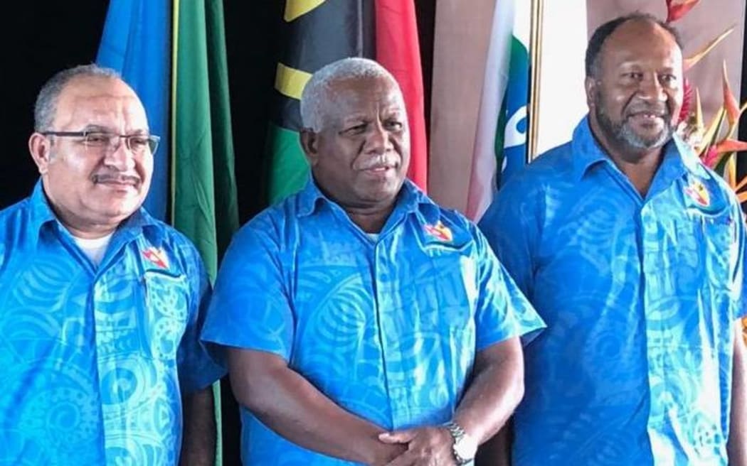 Peter O'Neill, Rick Houenipwela and Charlot Salwai.