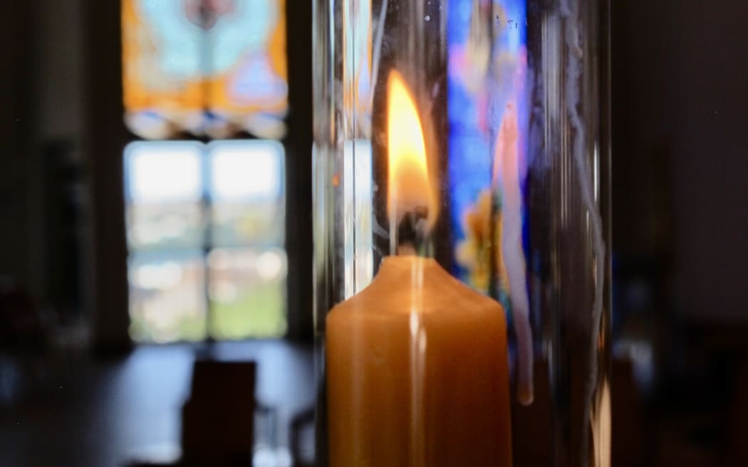 candle and stained glass