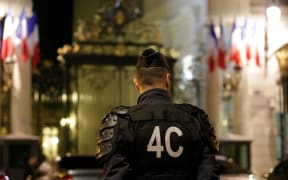 Police officers stand outside the French Interior Ministry in Paris on 15 July 2016.