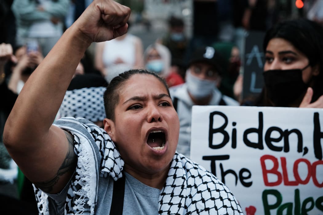 Thousands of protesters and activists shut down a street as they voice anger at Israel and support of Palestinians in New York City.