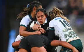 Sylvia Brunt of New Zealand is tackled, 2025 World Cup.