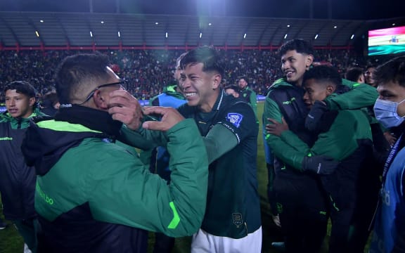 Bolivia's midfielder #16 Ervin Vaca celebrates with a teammate after winning the 2026 FIFA World Cup South American qualifiers football match between Bolivia and Brazil at the Municipal de El Alto Stadium in El Alto, Bolivia on September 9, 20 (Photo by Daniel MIRANDA / AFP)