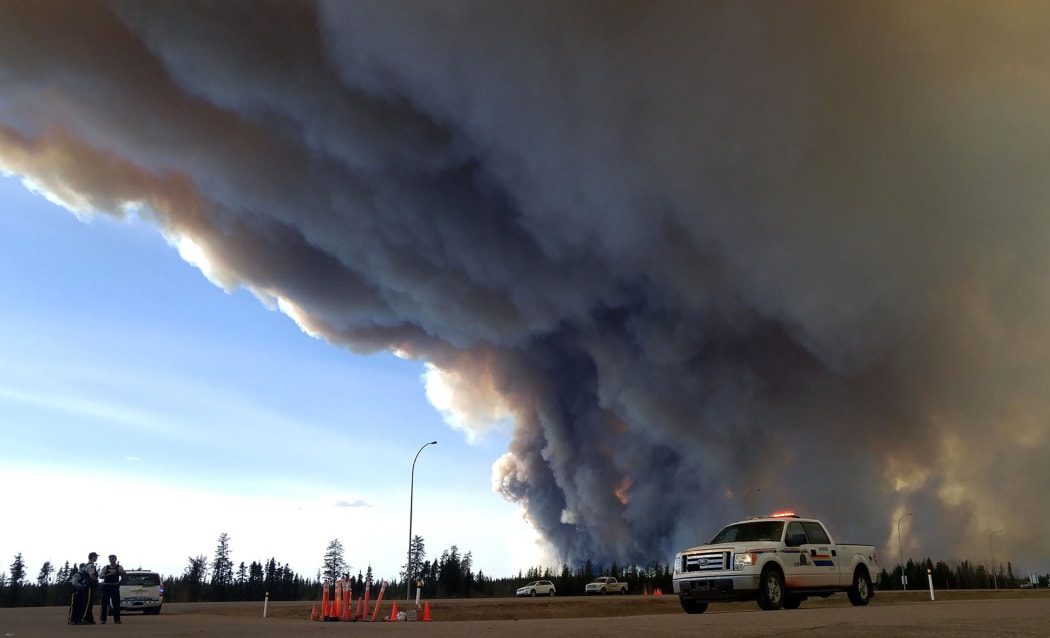 The ferocious wildfire wreaking havoc in Canada has doubled in size.