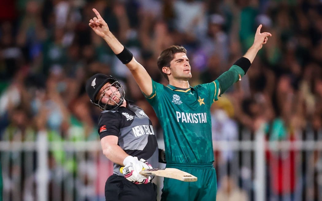 Black Cap Tim Seifert runs into Pakistan's Shaheen Shah Afridi.