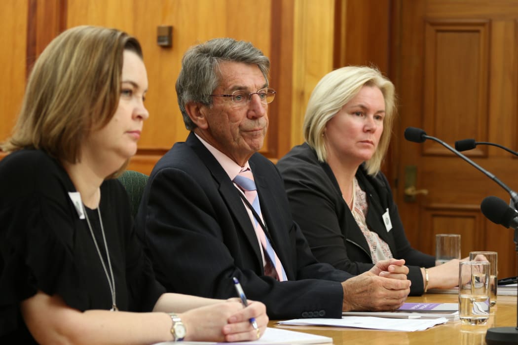 Chief Ombudsman Judge Peter Boshier (center), Deputy Ombudsman Compliance  and Practice Emma Leach (left) and Chief Inspector OPCAT Jacki Jones, (right) speak to the Law and Order Committee about the illegal restraint of at risk prisoners.