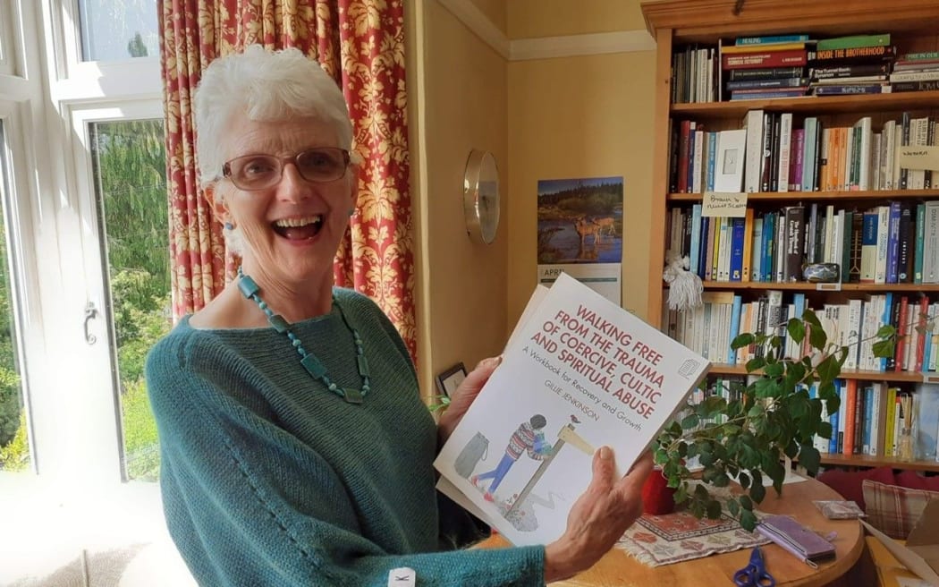 Gillie Jenkinson with her booklet on leaving and recovering from cults.
