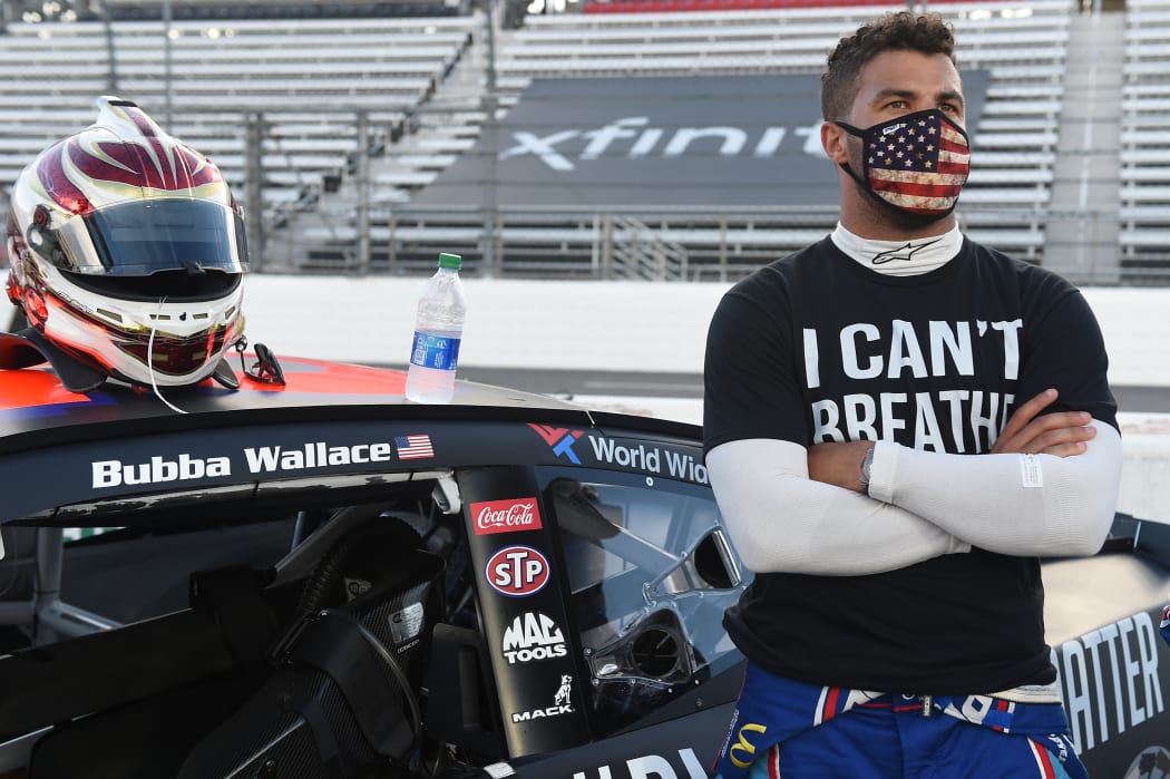 Nascar driver Bubba Wallace wears a "I Can't Breathe - Black Lives Matter" t-shirt.