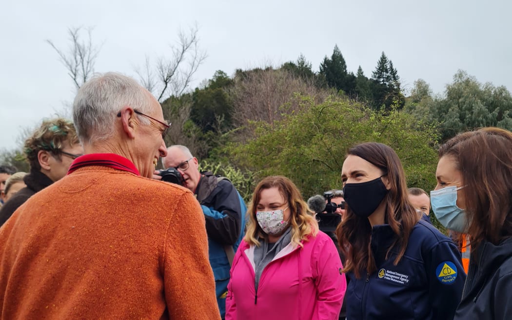 Jacinda Ardern speaking to David Wheeler. She spent the day surveying the damage from last week's floods and hearing from residents affected by the deluge.