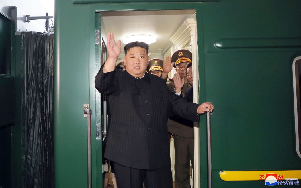 This picture taken on September 10, 2023 and released from North Korea's official Korean Central News Agency (KCNA) on September 12, 2023 shows North Korea's leader Kim Jong Un (C) waving as he departs by train from Pyongyang for a visit to Russia. North Korea's leader Kim Jong Un was en route to Russia by armoured train to meet President Vladimir Putin, state media reported on September 12, with the face-to-face discussions potentially focused on weapon sales. (Photo by KCNA VIA KNS / AFP) / South Korea OUT / REPUBLIC OF KOREA OUT
---EDITORS NOTE--- RESTRICTED TO EDITORIAL USE - MANDATORY CREDIT "AFP PHOTO/KCNA VIA KNS" - NO MARKETING NO ADVERTISING CAMPAIGNS - DISTRIBUTED AS A SERVICE TO CLIENTS / THIS PICTURE WAS MADE AVAILABLE BY A THIRD PARTY. AFP CAN NOT INDEPENDENTLY VERIFY THE AUTHENTICITY, LOCATION, DATE AND CONTENT OF THIS IMAGE --- /