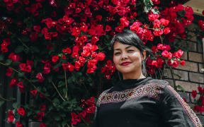 Dewi Astutipuji in her garden at her home in Hamilton.