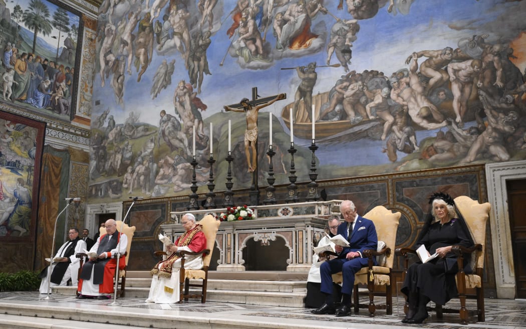 This photo taken and handout on October 23, 2025 by The Vatican Media shows Britain's King Charles III and Britain's Queen Camilla during an Eucumenical prayer led by Pope Leo XIV in the Sistine Chapel in The Vatican.