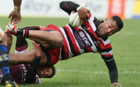 Counties Frank Halai break-dances out of a tackle