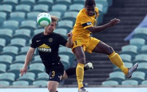 Team Wellington's Steven Gulley and Magenta's Noel Kaudre compete for the ball durnig the OFC semi-final.
