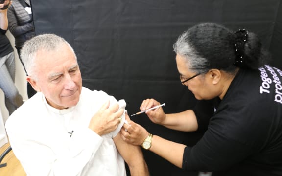 The Catholic Archbishop of Wellington, Cardinal John Dew, gets vaccinated against Covid-19, 9 June, 2021.