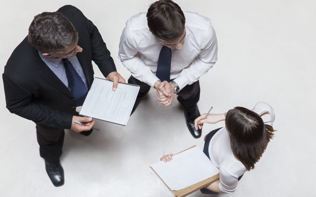 Executives in meeting, overhead view