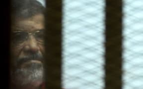 Egypt's ousted president Mohamed Morsi during his trial on espionage charges in Cairo on June 18, 2016.