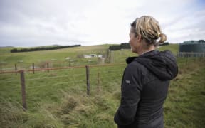 Susan McEwan, in front of her former farm, badly affect ed by the M Bovis in 2015.