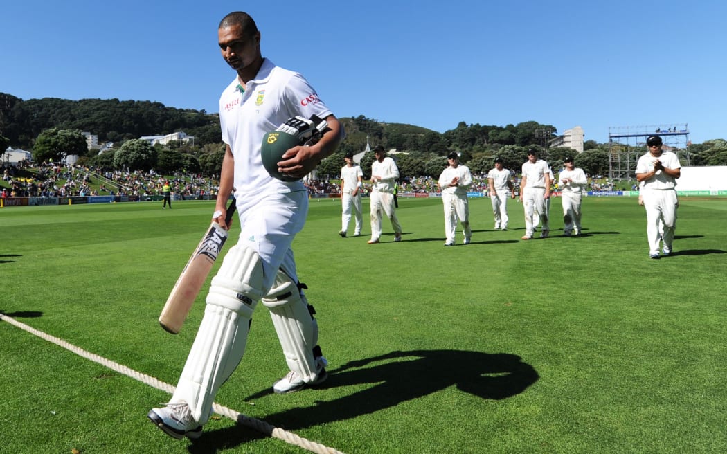 Alviro Petersen leads players off the Basin Reserve, 2012.
