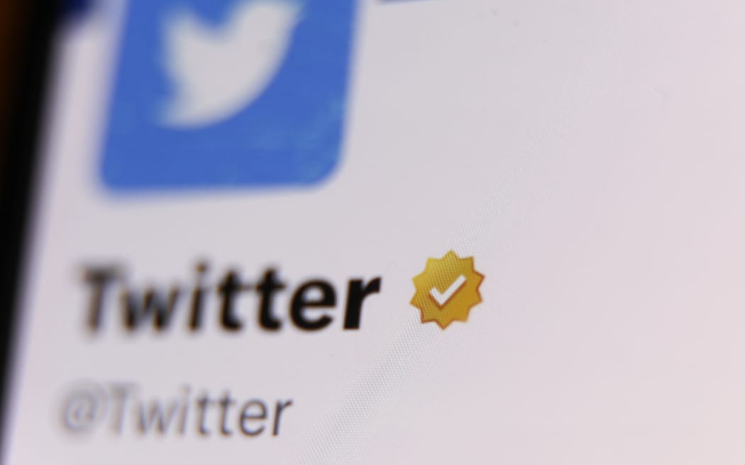 The gold checkmark on Twitter account on Twitter is seen displayed on a phone screen in this illustration photo taken in Krakow, Poland on February 14, 2023 (Photo by Jakub Porzycki/NurPhoto) (Photo by Jakub Porzycki / NurPhoto / NurPhoto via AFP)