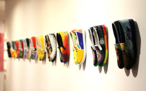 Artists in prisons transformed plain canvas shoes for the Worn exhibition.