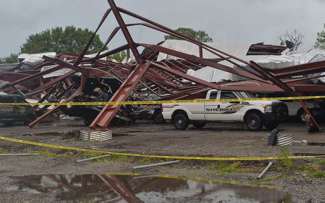 The St. Lucie County Sheriff's Office was damaged in Fort Pierce as Hurricane Milton crossed into Florida. Parts of the building collapsed on a department patrol pickup truck.