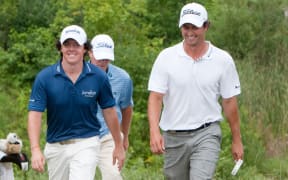 Rory McIlroy and Adam Scott competing on the PGA Tour in 2010