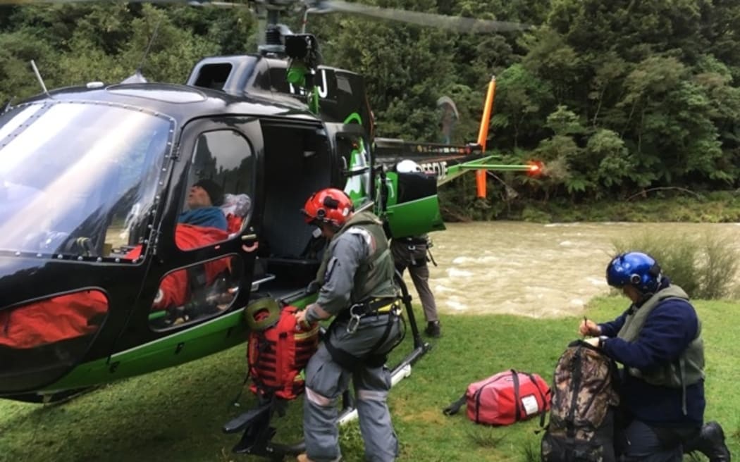 The man in the safe hands of rescue helicopter staff.