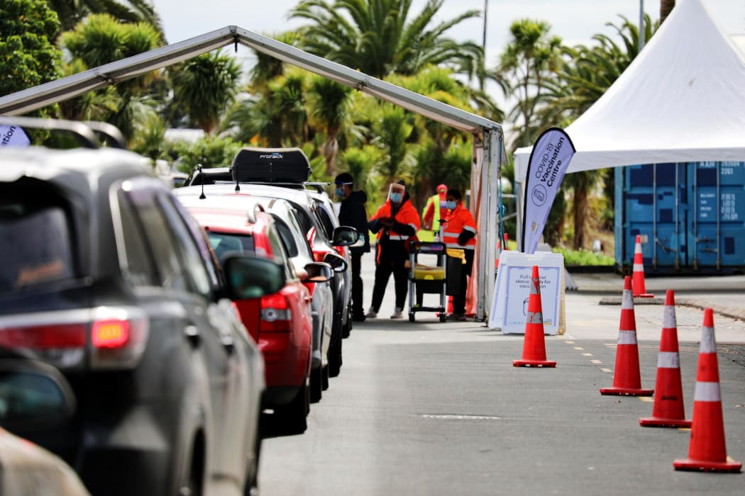 People waiting for their turn at the drive-through vaccination centre at The Trusts Arena, Auckland.