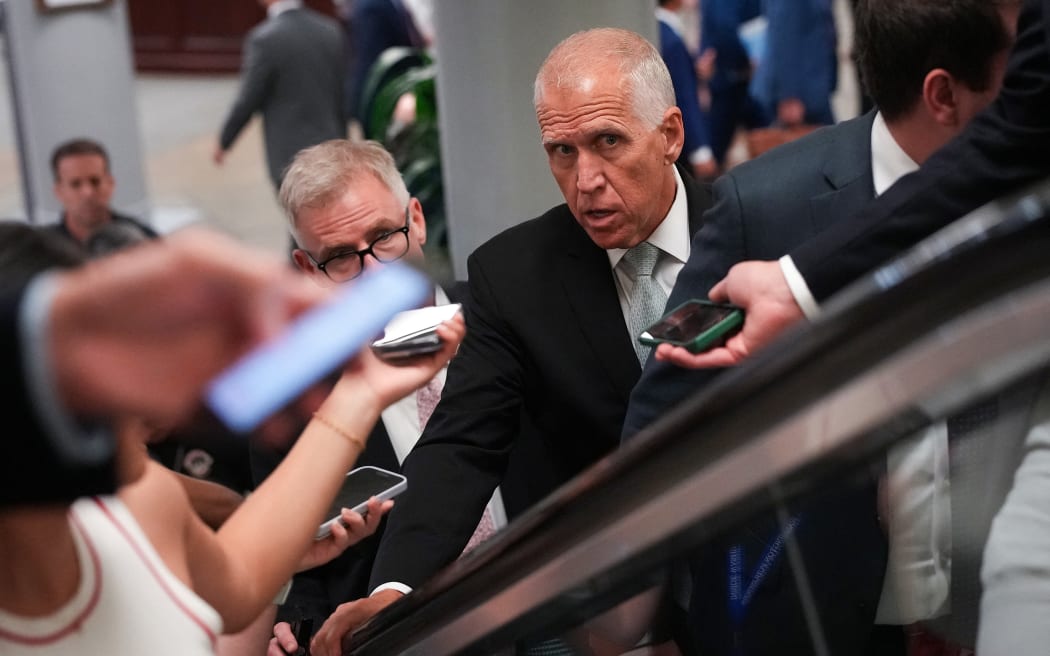 WASHINGTON, DC - JUNE 25: U.S. Sen. Thom Tillis (R-NC) talks to reporters as he walks to the Senate Chamber at the U.S. Capitol on June 25, 2025 in Washington, DC. Republican lawmakers are aiming to complete passage of the "One, Big, Beautiful Bill" by this weekend, which by some estimates would add at least $2.8 trillion to the $36.2 trillion U.S. debt in the long term.   Kevin Dietsch/Getty Images/AFP (Photo by Kevin Dietsch / GETTY IMAGES NORTH AMERICA / Getty Images via AFP)