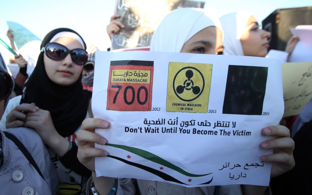 Syrians in Jordan protest the massacre of al Ghouta, in front of the Syrian embassy in Amman, Jordan, on August 23, 2013.