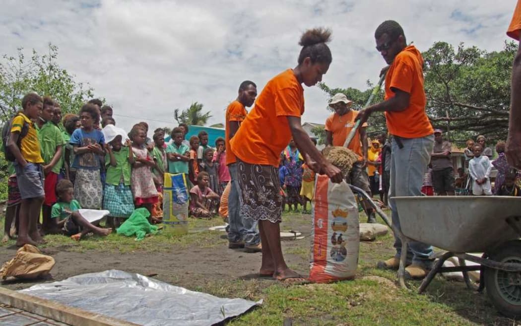 Tanna villagers learn how to build a latrine