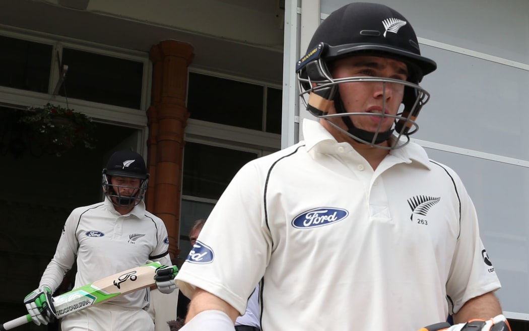 The Black Caps openers Tom Latham (r) and Martin Guptill (l) walk out to bat.