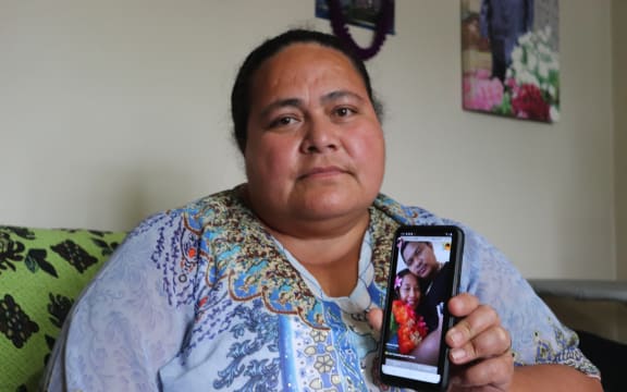 Lofa Tuimaualuga holds a photo of her nephew Tino Tagiilima, with his wife. Tagiilima died in a tragic highway crash in the North Island yesterday.