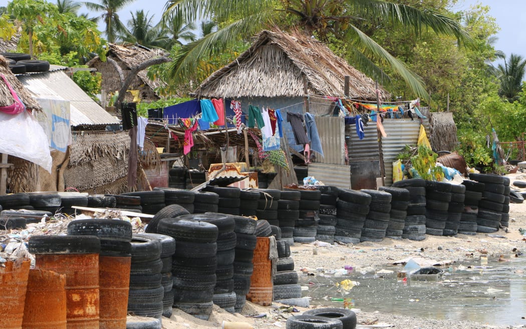 Kiribati villagers have resorted to using tires and barrels for protection from the sea