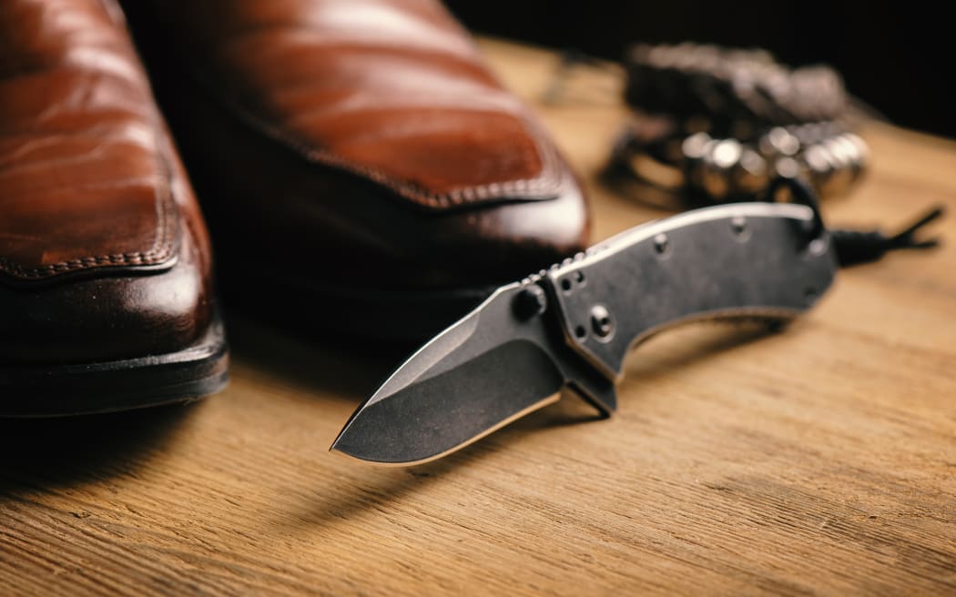 stainless steel pocketknife with blackwash finish on blade and handle