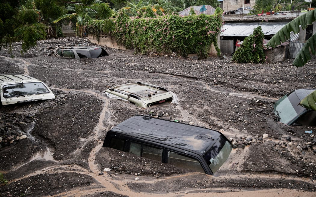 Cars are submerged in mud following Hurricane Melissa in Petit-Goave, 68km southwest of Port-au-Prince, on October 30, 2025. Hurricane Melissa was moving towards Bermuda on Thursday after ripping a path of destruction through the Caribbean that left at least 20 people dead in Haiti, and parts of Jamaica and Cuba in ruins.