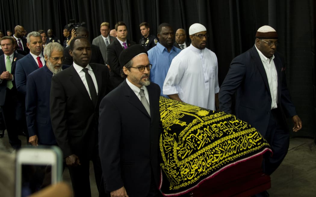 Pallbearers escort the casket of boxing legend Muhammad Ali during the Jenazah prayer service at Freedom Hall in Louisville, Kentucky.