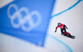 (FILES) Switzerland's Sophie Hediger competes in the snowboard women's cross seeding run during the Beijing 2022 Winter Olympic Games at the Genting Snow Park P & X Stadium in Zhangjiakou on February 9, 2022. - Swiss snowboarder Sophie Hediger, who had two World Cup podium finishes to her name and had taken part in the Olympic Games in 2022, died in an avalanche on December 23, 2024, in Arosa, eastern Switzerland, the Swiss Ski Federation said on December 24, 2024. (Photo by Marco BERTORELLO / AFP)