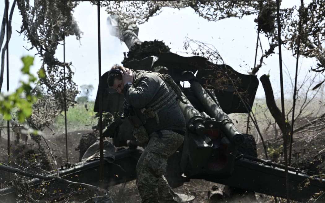 A file photo from 20 July, 2023, shows a Ukrainian artilleryman firing a 152mm towed gun-howitzer D-20 at Russian positions near Bakhmut, eastern Ukraine. Ukraine's military authorities said on 15 September, 2023 that its troops had captured the village of Andriivka, south of Bakhmut.