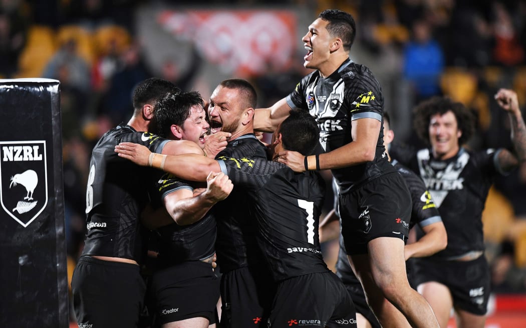 Kiwis' captain Dallin Watene-Zelezniak and team mates celebrate a try in win against Australia