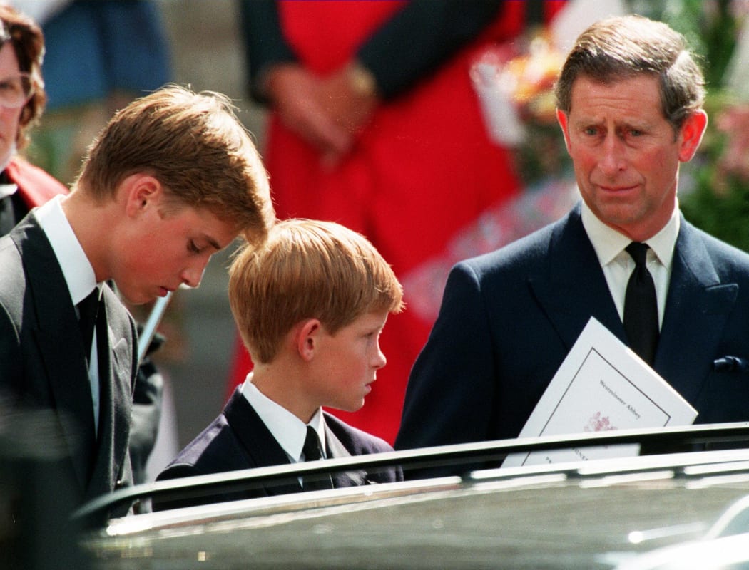 Prince Charles and Harry and William wait in front of the Westminster Abbey in London after the funeral ceremony of Princess of Wales